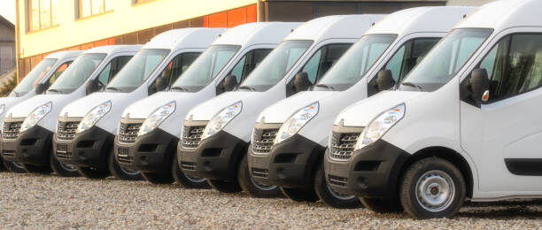 commercial delivery vans parked in row. Transporting service company.